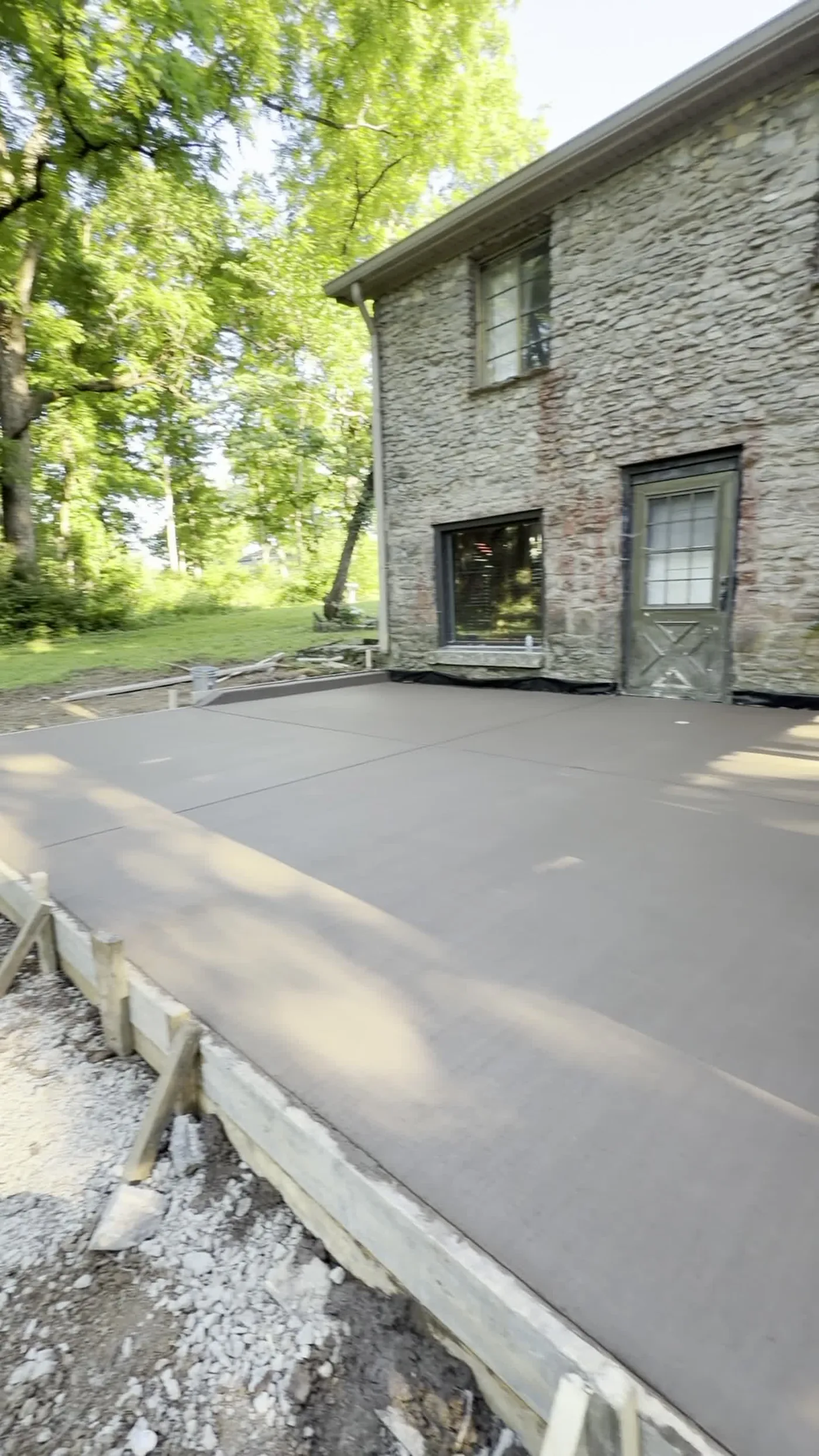 Finished concrete driveway and patio poured by Pumas Concrete in Middle Tennessee